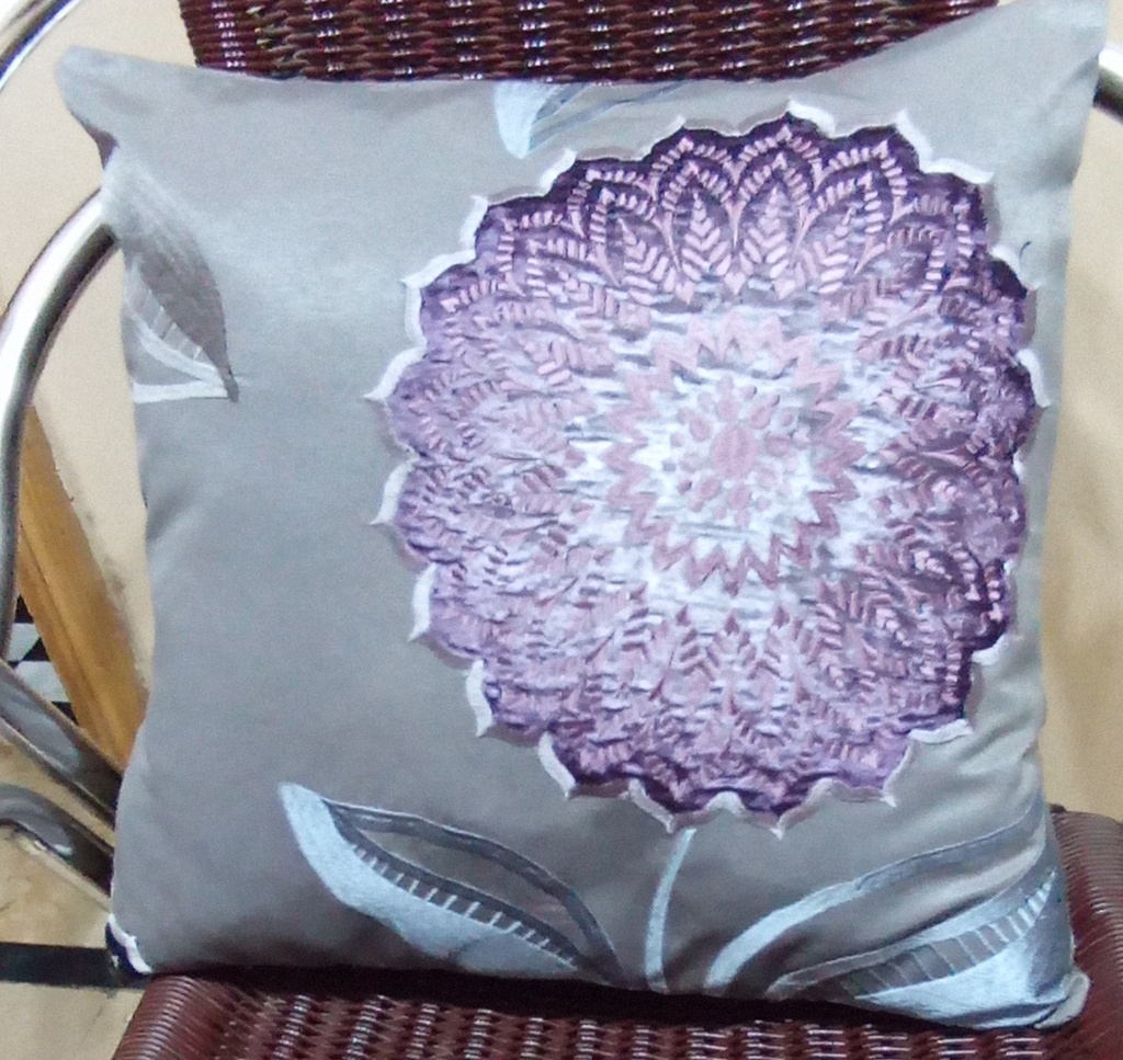 Embroidered cushion pair