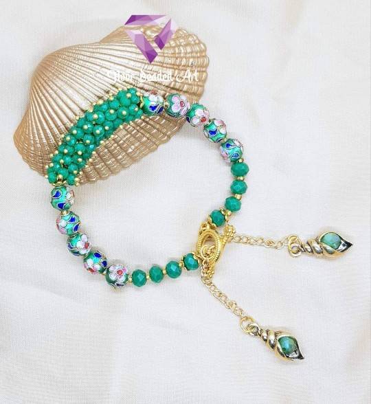 Dark green bangle bracelet with charms