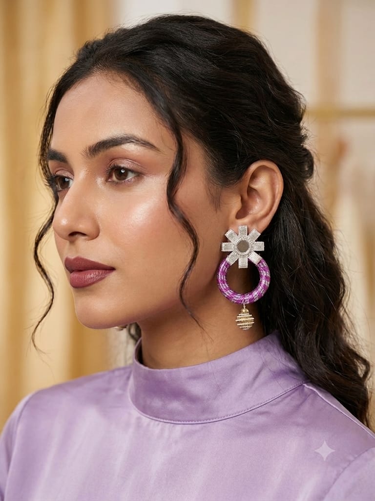 Purple lace-wrapped hoop with a star-shaped mirror stud and delicate hanging charm at the base.