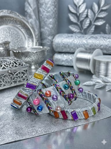 Silver base bangles wrapped with decorative colorful pearls and rectangular stones.