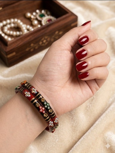 Grace your wrists with these elegant red and black bangles.