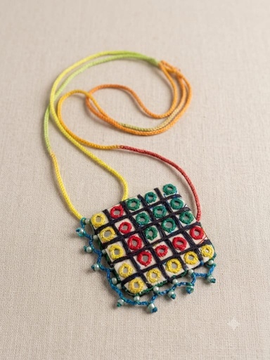 Handcrafted textile pandant,likely inspired by traditional Rabari or Banjara embroidery techniques from South Asia.